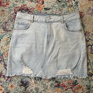 Light blue distressed denim mini jean skirt